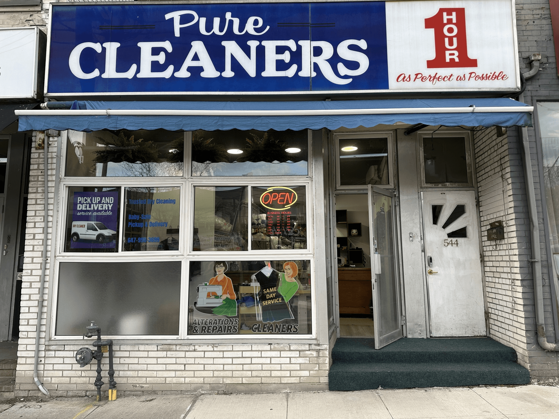 Pure Cleaners storefront at 544 Eglinton Ave W